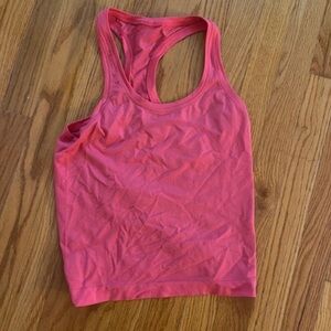 Bright pink lululemon swiftly tank